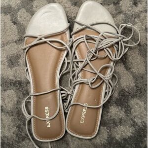 Brand new Express brand. ivory. Size 10. Flat tie-up sandal.
